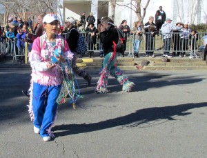 Marcher throwing beads