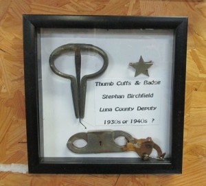 Thumb cuffs and badge