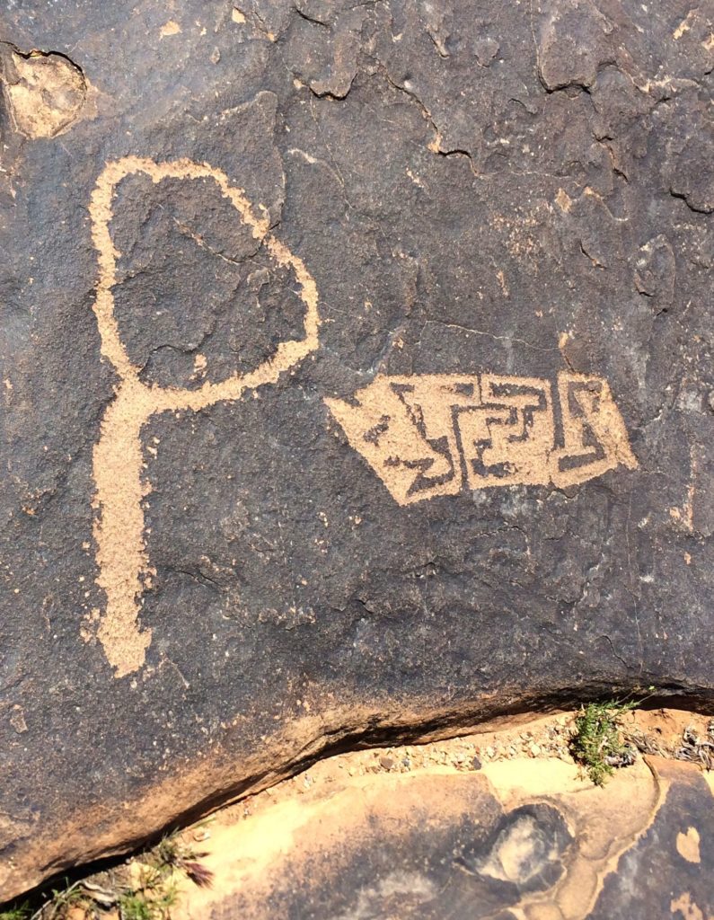 Circle with tail and geometric design