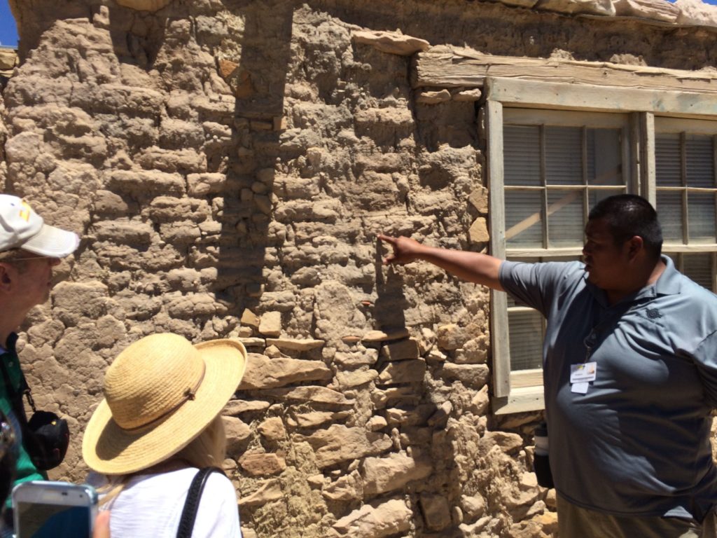 Brandon pointing out adobe with inclusions