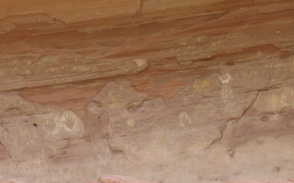 Kokopelli cave with hand print glyphs