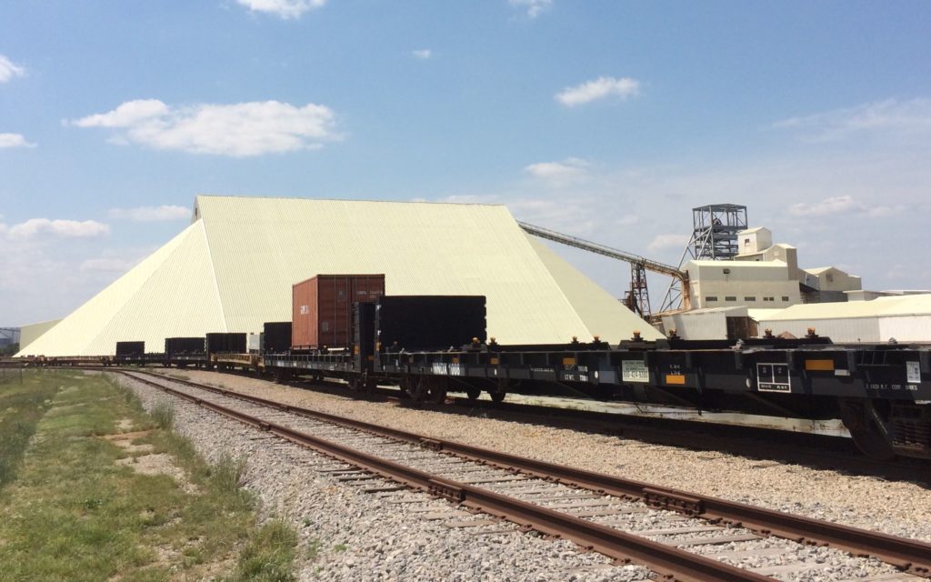 Salt storage shed with trains