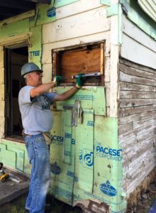 Bob working on a window