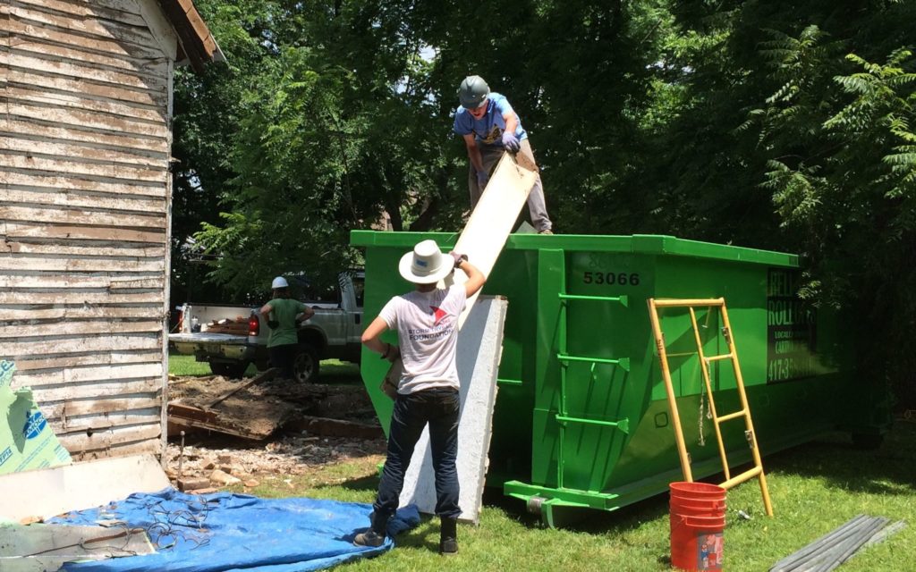 Filling the dumpster - Rick and one of the boys