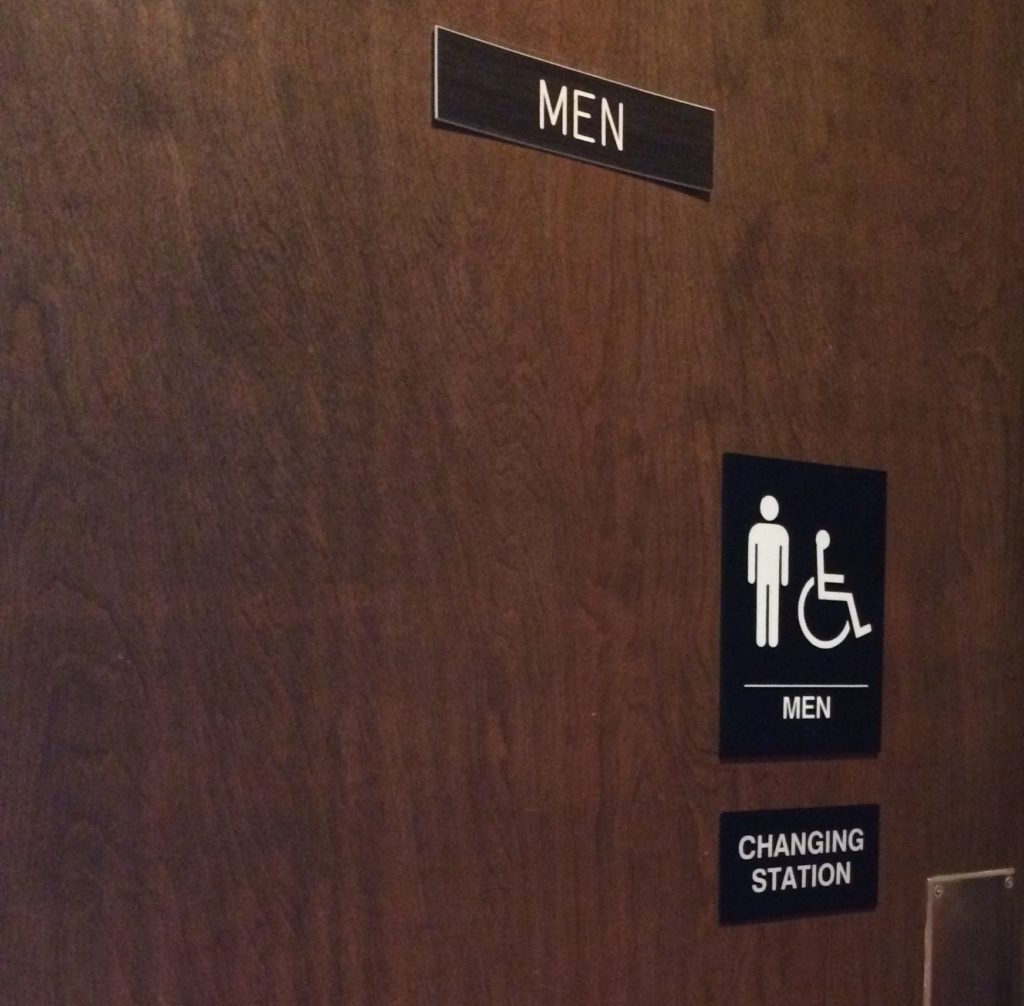 Mens room with changing station