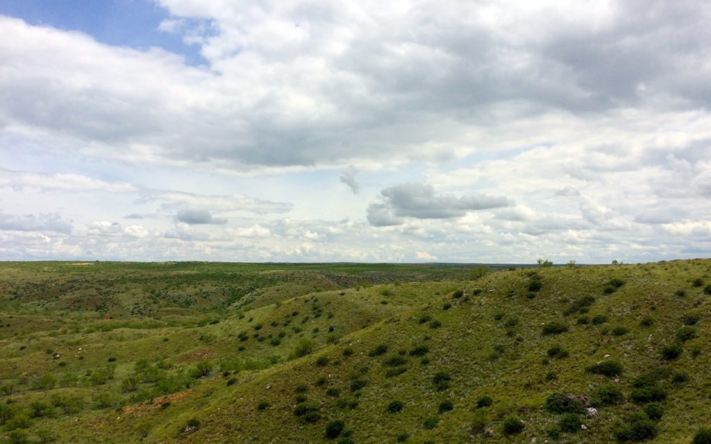 light colored ridge is the site of the village